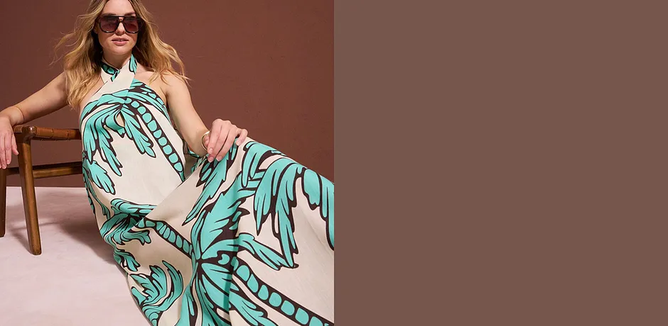 Robe d'été turquoise à motif tropical avec palmiers.