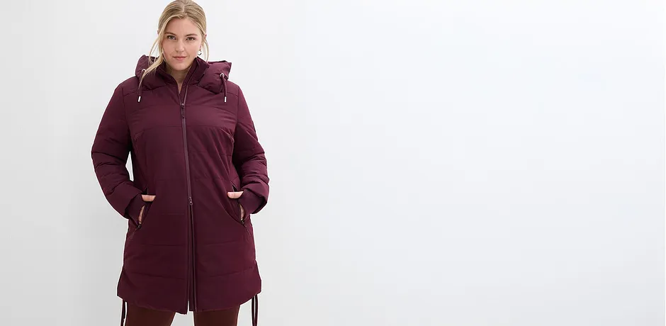 Manteau d'hiver chaud couleur bourgogne avec capuche et fermeture zippée.