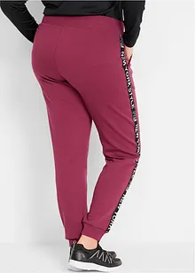 Pantalon en molleton avec lien à nouer et message imprimé, bonprix